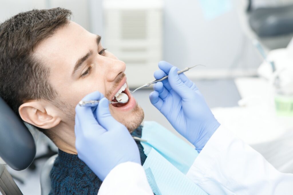 Young man visiting the dentist