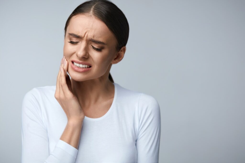 Woman suffering from dental pain