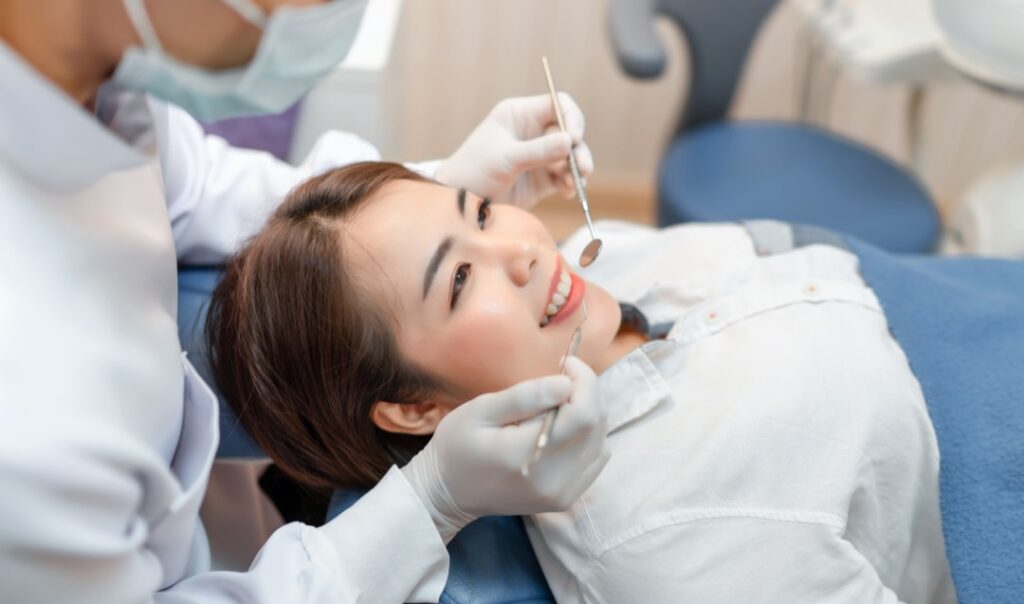 Woman sitting in dentists chair